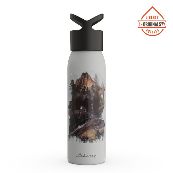 A grizzly in the mountains printed on a light grey bottle
